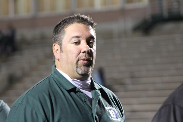 A Whiting coach looks across the field.